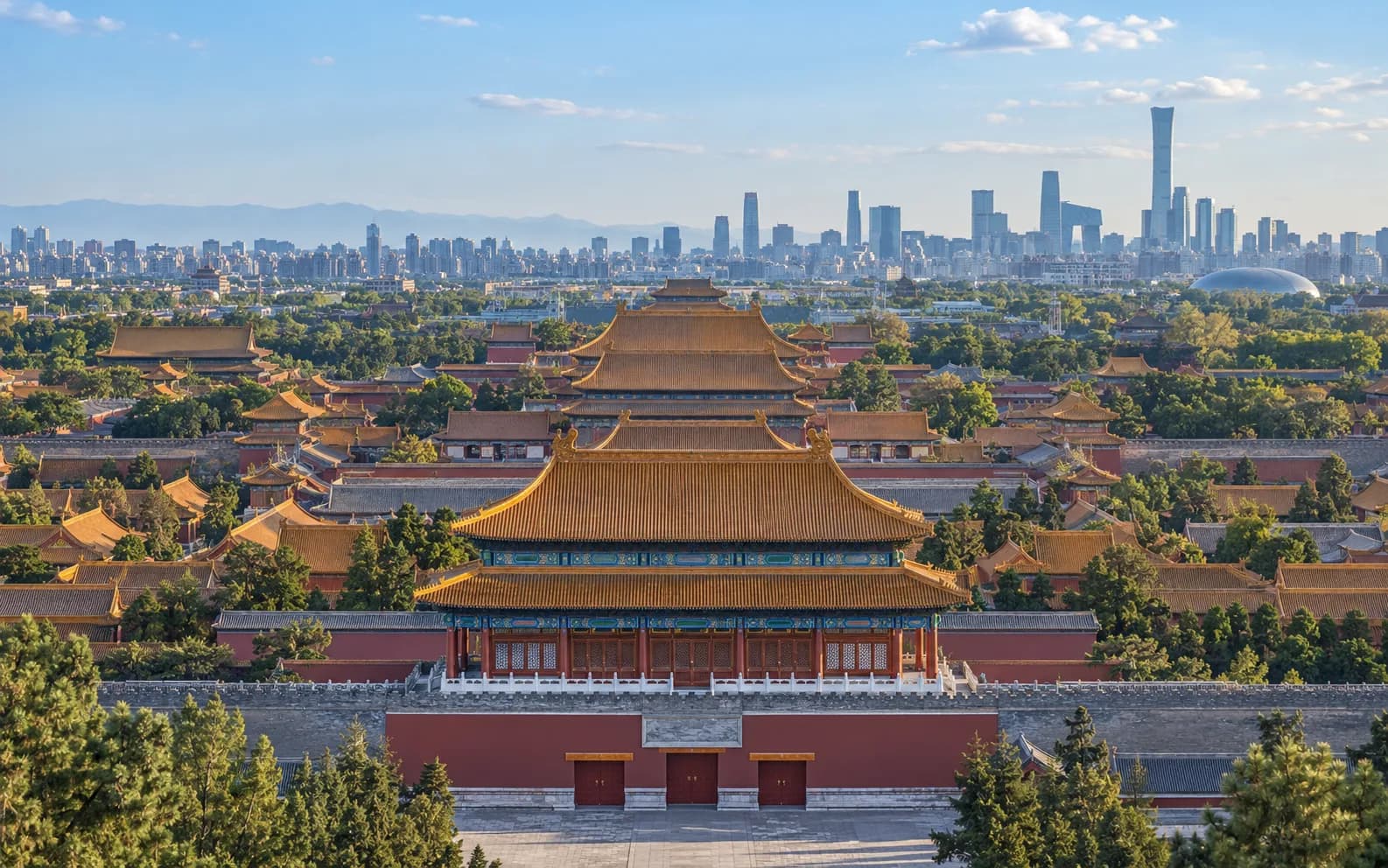 Historic Forbidden City rooftops and the modern Beijing skyline in China